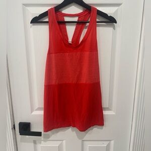 Lululemon Pedal To The Medal Singlet
Heathered Alarming Orange Tank Top Size:8